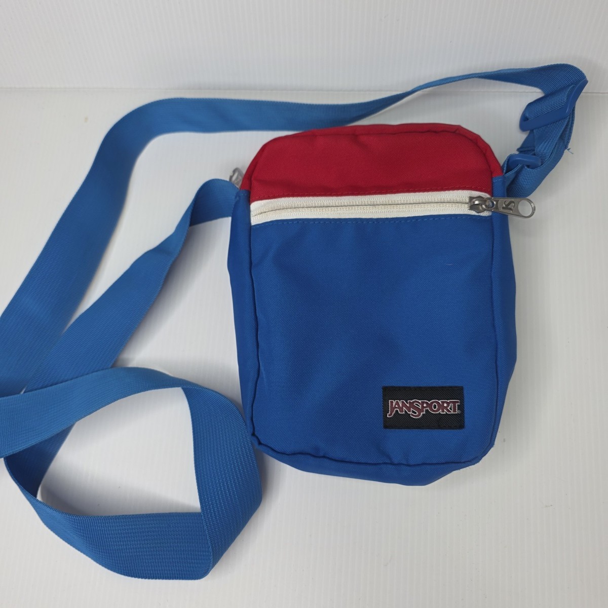 Jansport  red lettering Light Blue Sling Bag. Move Sling – JanSport US main image 4