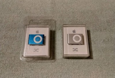 2 Factory Sealed Apple iPod Shuffles Model A1204 2GB Silver And Blue