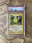 PSA 9 Pikachu 1st Edition 1999 Pokémon Jungle #60