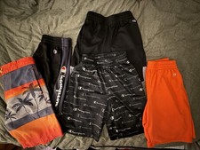 4 Pair of Champion shorts and 1 pair Wonder Nation swim trunks Size 7/8