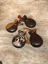 2 pairs of wood castanets, one pair ornately decorated with  Flamenco Dancers