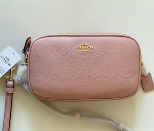 coach crossbody clutch in pebble leather