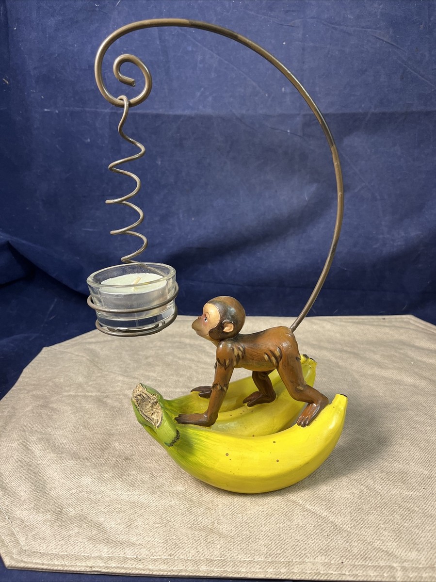 Rare Monkey Climbing on Bananas Holding a Tea Light Candle with