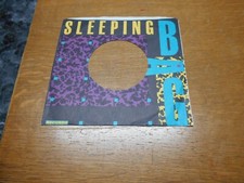 45 COMPANY RECORD SLEEVES. LOT OF ONE SLEEPING BAG.