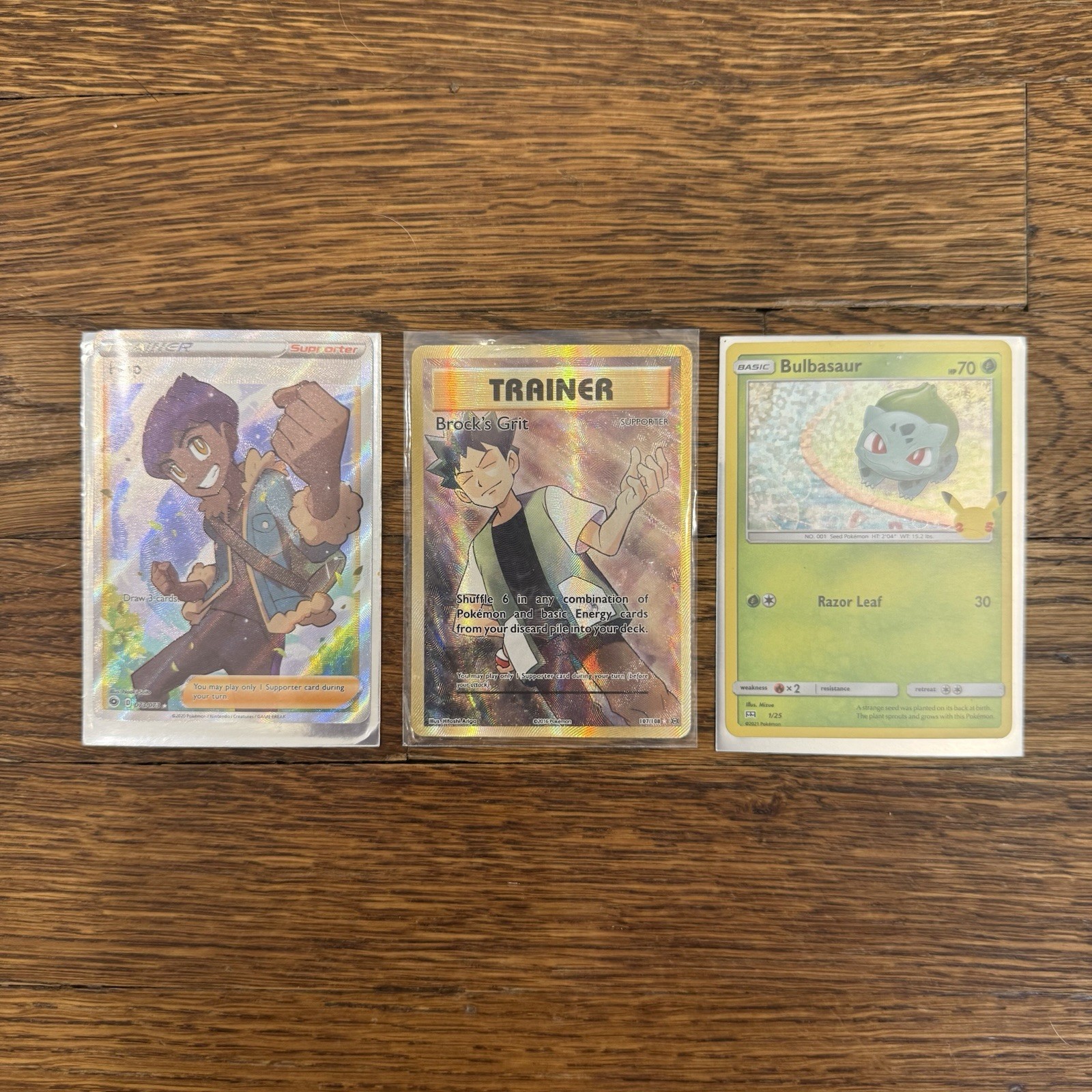 Pokemon 3 Card Lot Hop 073/073 Brock’s Grit 107/108 Bulbasaur Full Art NM/LP