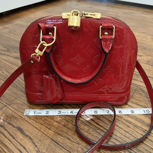 Louis Vuitton Alma BB bag in red Vernis patent leather with gold-tone hardware