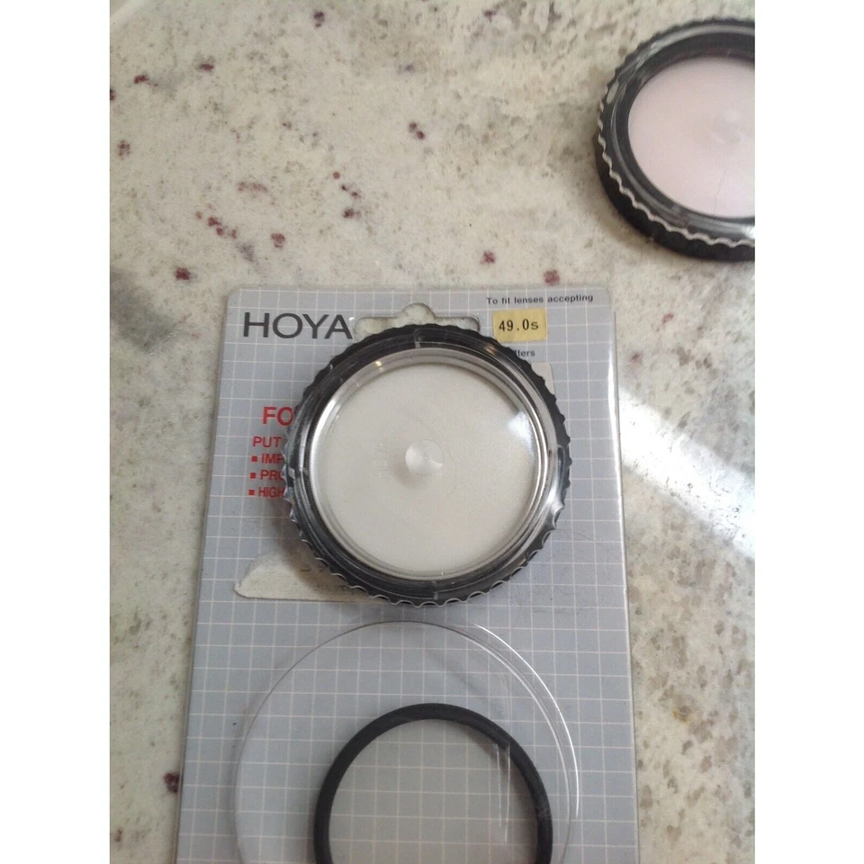Lote de filtros de lente cuatro 55MM uno 52MM y otro 49MM Hoya Promaster y Yashica Foto 2 de 4