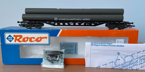Roco HO 46214 DB sehr langer Radstand 4achs Flachsprossenwagen mit Rohrladung | Condition: Used