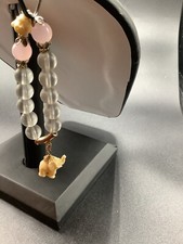 Stretch Bracelet with Clear Beads Faux Ivory Buddha and Elephant Charm 1-223