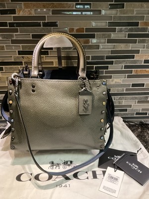 coach rogue with rivets