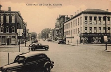 Postcard Circleville OH: Corner Main & Court Sts. 5 & 10 Store, Old Cars, People