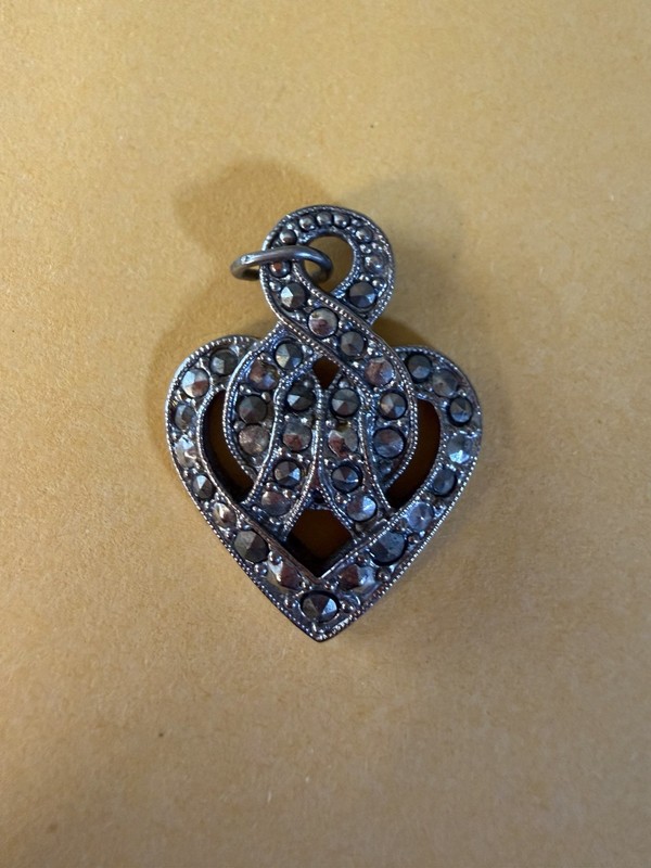 vintage marcasite heart pendant infinity love knot motif integrated into a heart
