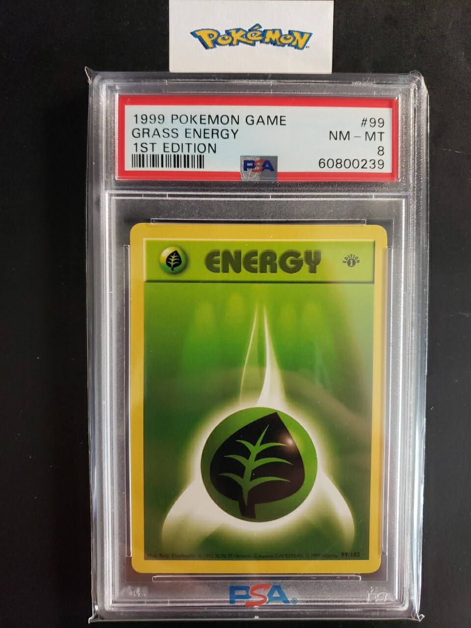 First Edition 1999 Pokemon Base Set 99/102 Grass Energy PSA NM-MT 8