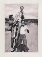 Group of Attractive Handsome Muscular Young Men, Two Carry the Third Gay Int