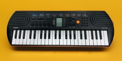 CASIO SA-76 Mini Electronic Keyboard 100 Tones 50 Rhythms Orange/Black Works