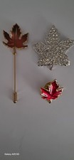 3 Maple Leafs, 1 Lapel  Pin,1 Stick Pin And 1 Brooche