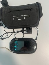 Black Sony PSP 1000 Series bundle with UMD, games  sleeve and carry bag.