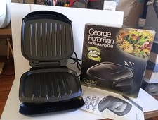 George Foreman Fat Reducing Grill Compact Two Portion Boxed Used Once.