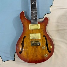 Custom 6-string electric guitar with gold hardware. Fast shipping from the USA.