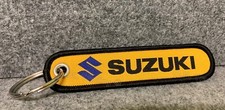 SUZUKI Llavero NegroAmarillo Procesamiento Extra Rápido