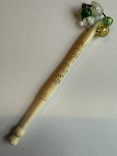 A DELIGHTFUL ANTIQUE BONE LACE MAKING BOBBIN WITH SPANGLES. NAMED. ANNIE