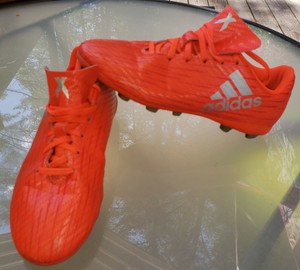 neon orange football cleats