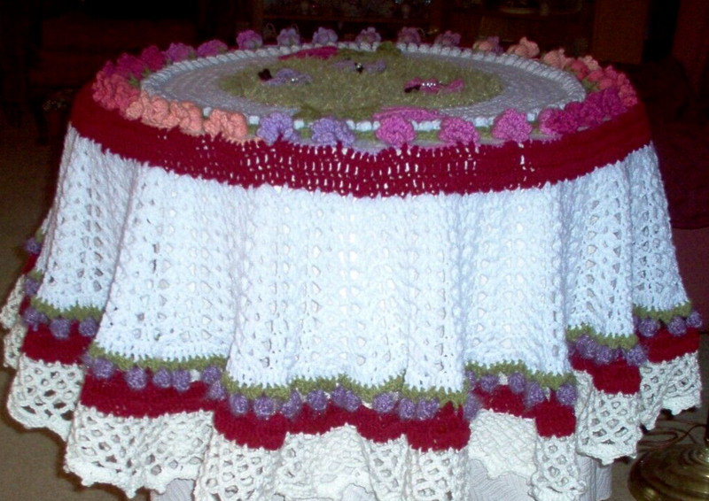 Handcrafted/crochet tablecloth with 3 D flowers and butterflies. 60" Dia  a