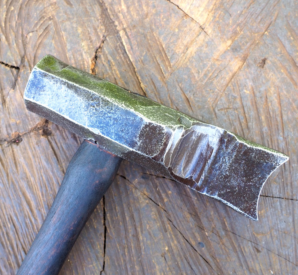 A 19th-century offset top swage hammer built for shaping hot iron — a sculptural blacksmithing relic that doubles as serious industrial art.