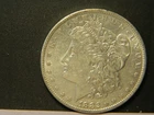 1882 O/S MORGAN SILVER DOLLAR AU