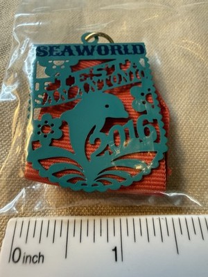 2016 Sea World Teal Dolphin Paper Pical Fiesta Medal