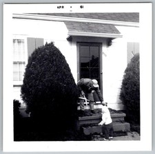 Vtg B&W Snapshot Man Trimming Bush With Shears And Baby On Porch Steps 1961