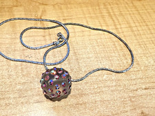 VINTAGE ACRYLIC BALL WITH RED AURORA BOREALIS CRYSTALS ON A LONG SILVER CHAIN