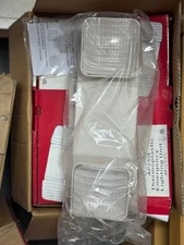 Three Brand New boxes of Cooper Lighting Solutions AP2SQ emergency lights 