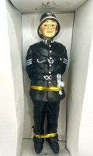 Miniature resin doll of a police officer.