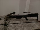 Camouflage Barnett QUAD-300 system 4 crossbow with compound limbs and visible “QUAD-300” text on the stock.