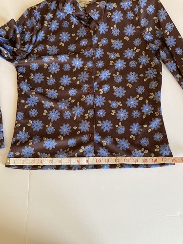 Brown and blue floral County Seat ladies shirt size M with button front, laid flat on measuring tape.