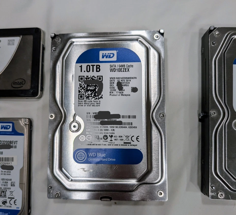Lot 4 Hard Drives-Intel SSD 60GB, WD Scorpio 320GB, 2x WD Blue 1TB (1 noisy) - Image 3 of 4