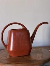 VTG Plastic Watering Can Garden Scene Made In USA Burnt Orange Embossed Leaves