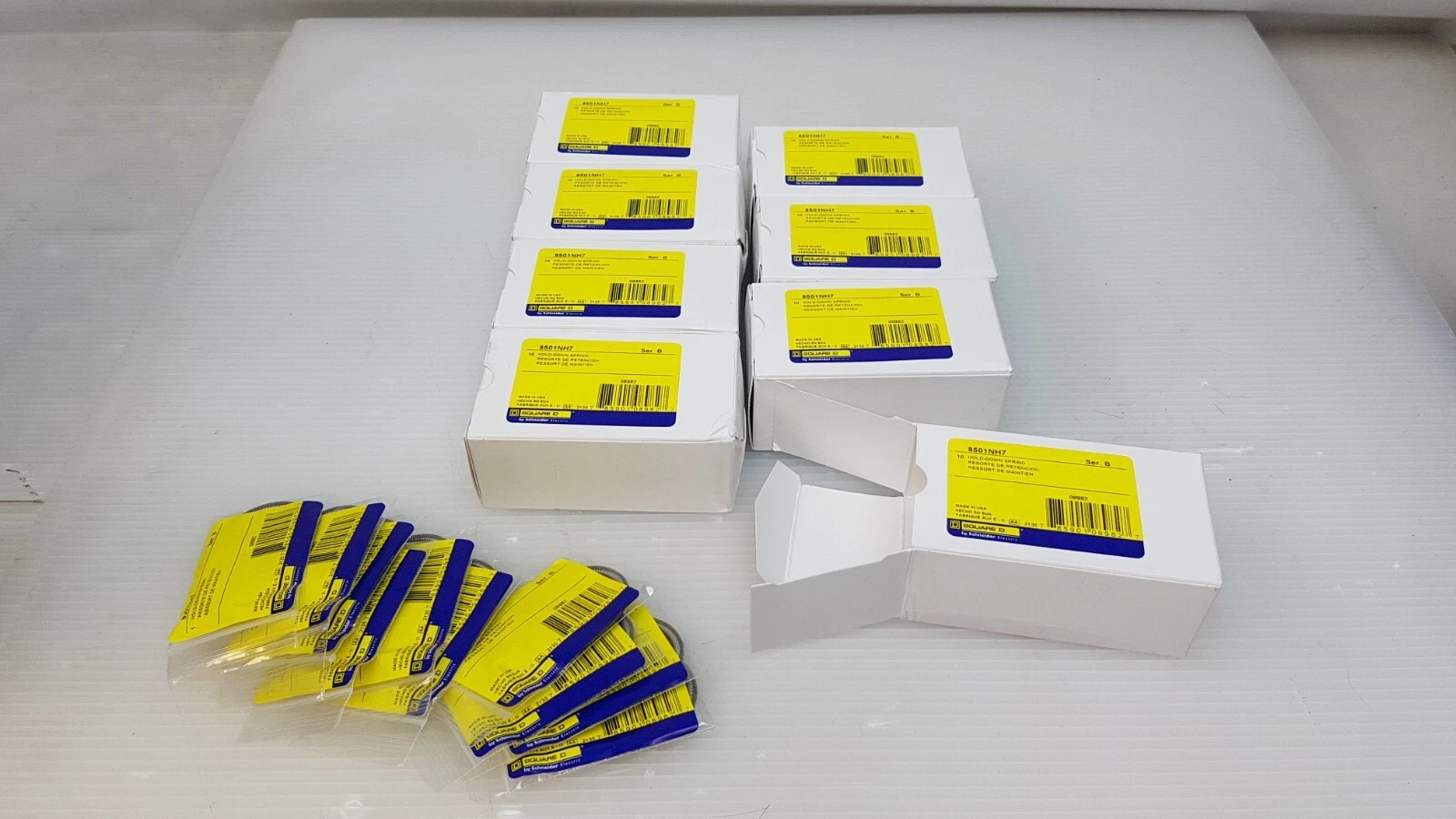 Square D 8501NH7 boxes with one box opened and ten bagged hold-down springs