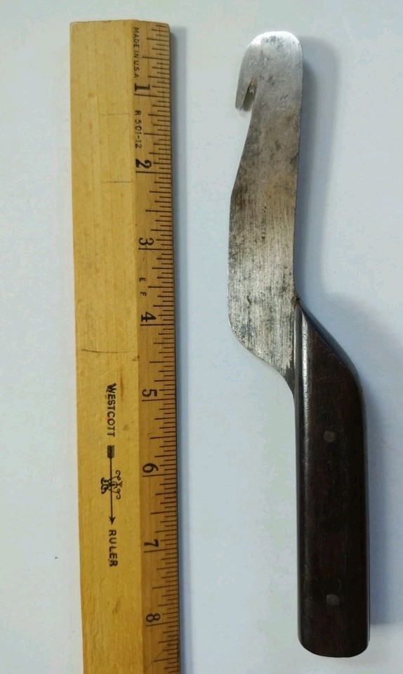 A patent-pending antique billhook/pruner hybrid with a wooden handle — the kind of mysterious hand tool that makes tool collectors and history nerds stop scrolling.
