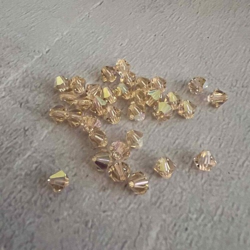 Perline sfaccettate bicono AB pesca chiaro 5 mm cristallo Swarovski austriaco - 34 pezzi - Foto 2 di 3