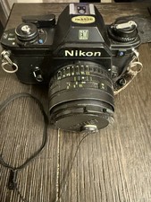 Nikon EM 35mm Film Camera  35mm f/2.5 Series E Lens w/ Manuals Filters