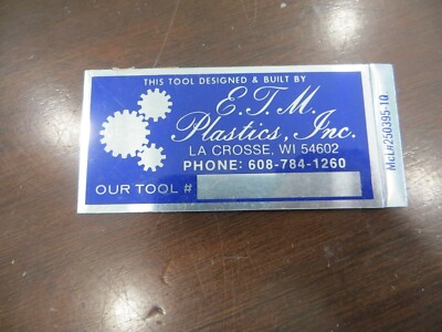 E.T.M.PLASTIC'S INC.LA CROSS WI TOOL DESIGNED & BUILT BY TAG EMBLEM SIGN