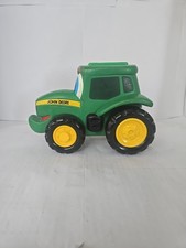 John Deere Vintage green rubber tractor 8in. x 5.5 in. Includes Booklet