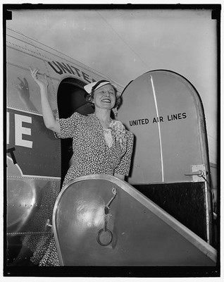Photo:United Air Lines Woman Boarding Plane 1940s Airplane Passenger Crew
