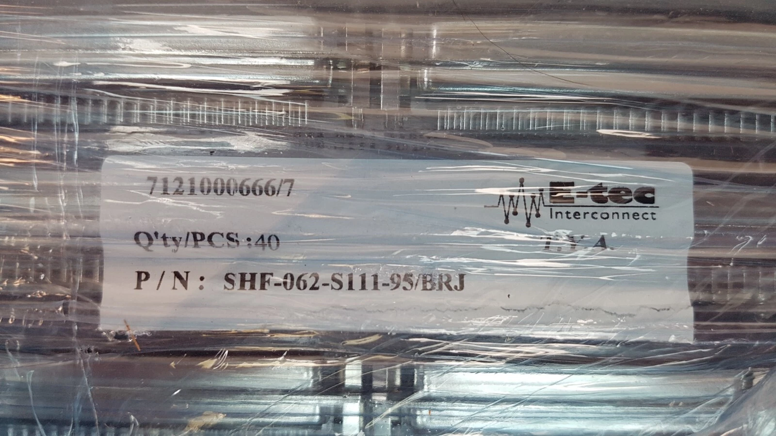 E-tec Interconnect pack label reading P/N SHF-062-S111-95/BRJ over the connector trays