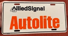 ALLIED SIGNAL FORD AUTOLITE booster license plate tag