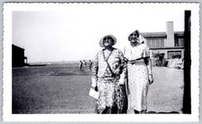 Vtg B&W Snapshot Two Women Patterned Dresses Hats Airfield Hangar Outdoor 1930s