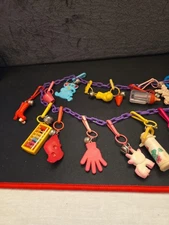 1980s Vintage Plastic Clip-On Bell Charms Necklace Bracelet 16 Charms