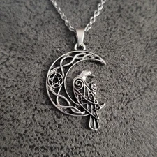 Raven sitting on a crescent moon celtic knotwork & pentagram necklace